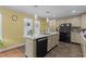 Modern kitchen with island and stainless steel appliances at 60 Bogey Ln, Louisburg, NC 27549