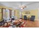 Living room featuring hardwood floors, a ceiling fan, and comfortable seating at 60 Bogey Ln, Louisburg, NC 27549