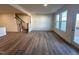 Spacious living area with hardwood floors and access to patio at 693 Leland Hill Cir, Zebulon, NC 27597