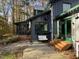 Stone patio area next to the house with a wooden deck at 82 Woodspryte Hollow Rd, Timberlake, NC 27583