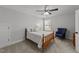 Bedroom with a full-size bed and a comfortable armchair at 8901 Brook Trout Ln, Willow Springs, NC 27592