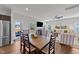 Open concept dining room with wood table and chairs, overlooking living room at 8901 Brook Trout Ln, Willow Springs, NC 27592