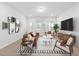 Bright living room featuring stylish furniture and large windows at 2840 Huxley Way, Apex, NC 27502