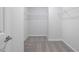 Walk-in closet with ample shelving and hanging space at 2840 Huxley Way, Apex, NC 27502