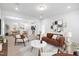 Open concept living room with a view of the kitchen and dining area at 2840 Huxley Way, Apex, NC 27502