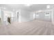 Spacious loft area with carpeted floors and plenty of natural light at 2864 Huxley Way, Apex, NC 27502