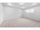 Well-lit bedroom featuring carpeted floors and a large window at 2864 Huxley Way, Apex, NC 27502