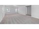 Generous-sized bedroom with carpet and access to a hallway at 2864 Huxley Way, Apex, NC 27502