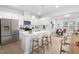 Modern kitchen with white cabinets and a large island at 2864 Huxley Way, Apex, NC 27502