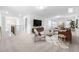 Spacious bonus room with stylish furniture and a large TV at 2884 Huxley Way, Apex, NC 27502