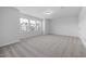 Well-lit bedroom with carpet and neutral decor at 2884 Huxley Way, Apex, NC 27502