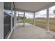 Relaxing screened porch overlooking a grassy backyard at 2884 Huxley Way, Apex, NC 27502