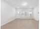 Light and airy living room features hardwood floors and access to backyard at 2884 Huxley Way, Apex, NC 27502
