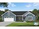 Two-story craftsman style home with blue siding and white trim at 77 Pretty Run Branch Ln, Wendell, NC 27591