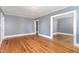 Bright living room with hardwood floors and neutral walls at 619 N Mebane St, Burlington, NC 27217