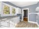 White kitchen with granite countertops and new vinyl flooring at 619 N Mebane St, Burlington, NC 27217