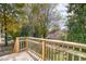 Wooden deck overlooking a green backyard with trees at 619 N Mebane St, Burlington, NC 27217