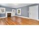 Spacious living room with hardwood floors, fireplace, and gray walls at 619 N Mebane St, Burlington, NC 27217