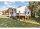 Side view of the house, showcasing a deck and yard at 619 N Mebane St, Burlington, NC 27217