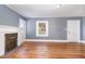Living room featuring hardwood floors, fireplace, and gray walls at 619 N Mebane St, Burlington, NC 27217