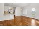 Kitchen and dining area with hardwood floors and white cabinetry at 909 Swan Rd, Nashville, NC 27856