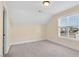 Bright bedroom featuring a large window and neutral wall colors at 522 Spruce Meadows Ln, Willow Springs, NC 27592