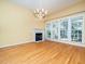 Elegant dining room with hardwood floors, fireplace, and large windows at 805 Ledgerock Rd, Wake Forest, NC 27587