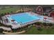 Resort-style pool with plenty of lounge chairs and umbrellas at 62 Windchime Ct, Fuquay Varina, NC 27526