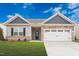 Ranch style home with stone and shingle accents, two-car garage, and landscaping at 108 Wilderness Ct, Mebane, NC 27302