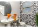 Stylish bathroom with patterned wallpaper and updated vanity at 296 Douglas Falls Dr, Wendell, NC 27591