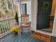 Inviting front porch with rocking chair and welcome mat at 7204 Bocage Pl, Wake Forest, NC 27587