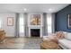 Living area featuring a fireplace and light gray curtains at 27 Comfort Ct, Fuquay Varina, NC 27526