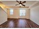 Bright living room with hardwood floors and a ceiling fan at 4114 Sykes St, Cary, NC 27519