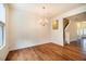 Elegant dining room with chandelier and hardwood floors at 3623 Landshire View Ln, Raleigh, NC 27616