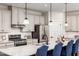 Modern kitchen features stainless steel appliances and granite countertops at 8832 Tartan Clan Dr, Willow Springs, NC 27592