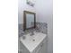 Bathroom with vanity and gray mosaic tile at 1717 Martin Luther King Dr, Rocky Mount, NC 27801