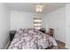 King-size bed in bedroom with wood floors and window curtains at 1717 Martin Luther King Dr, Rocky Mount, NC 27801