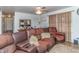 Living room features a brown leather sectional sofa and hardwood floors at 1717 Martin Luther King Dr, Rocky Mount, NC 27801