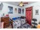 Bedroom with twin bed, dresser, and movie posters at 1717 Martin Luther King Dr, Rocky Mount, NC 27801