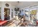 Bright screened porch with dining area and seating, perfect for relaxing at 185 Franklin Ln, Henderson, NC 27537