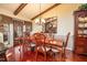 Elegant dining room with hardwood floors, a large table, and access to a patio at 185 Franklin Ln, Henderson, NC 27537