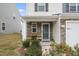 Front porch with stone detail and flowering plants at 737 Crackling Ct, Zebulon, NC 27597