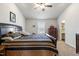 Bright bedroom featuring a king-size bed and ample closet space at 737 Crackling Ct, Zebulon, NC 27597