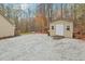 Yard with gravel driveway and a light beige storage shed at 5018 Silver Fox Ln, Efland, NC 27243
