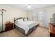Bedroom with double bed, nightstand, and ceiling fan at 104 Full Moon Ct, Garner, NC 27529