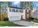 Two-story home with a brick and siding exterior at 104 Full Moon Ct, Garner, NC 27529