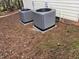 Two HVAC units sit on ground covered in pine straw at 104 Full Moon Ct, Garner, NC 27529