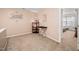 Small carpeted hallway with decorative wall art and storage at 104 Full Moon Ct, Garner, NC 27529