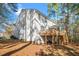Two-story house with deck, sunroom, and wooded backyard at 104 Full Moon Ct, Garner, NC 27529
