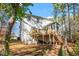 Two-story house with deck, sunroom, and wooded backyard at 104 Full Moon Ct, Garner, NC 27529